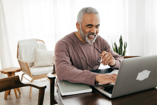 Senior men taking online lesson